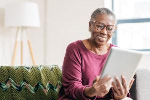 Senior women at home using tablet